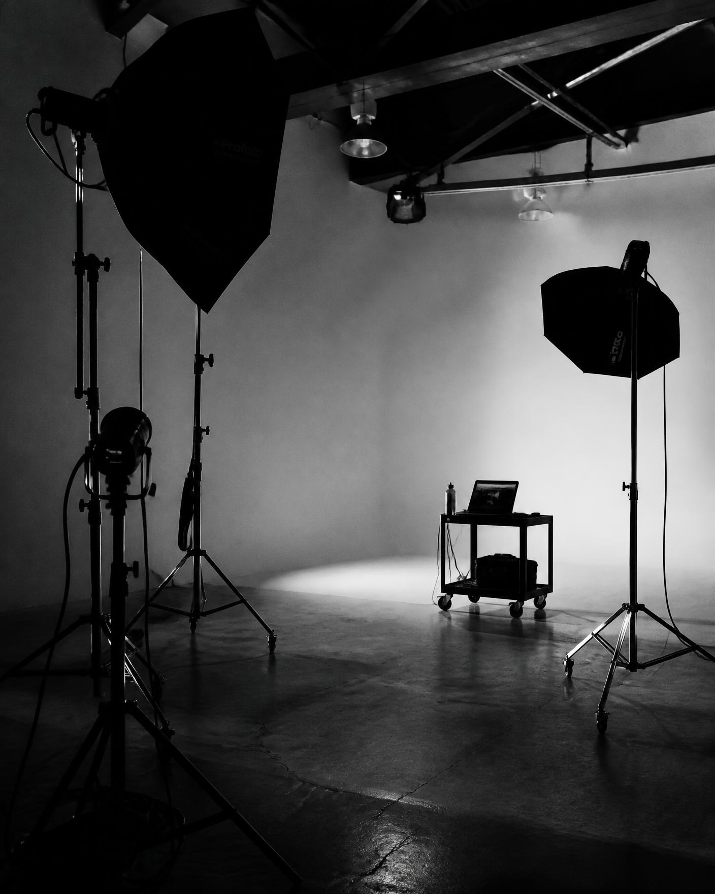 Empty production studio lit by softboxes